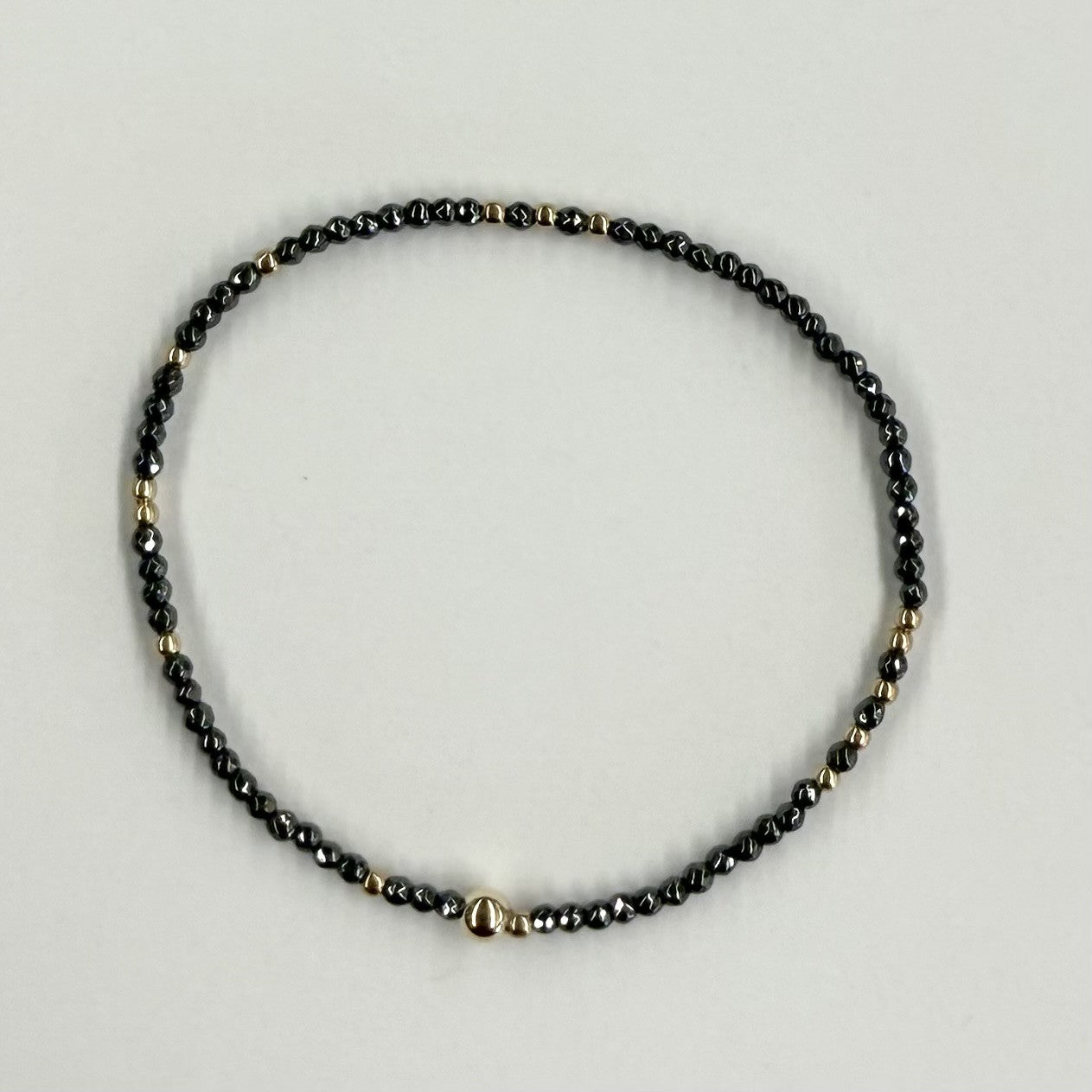 HOPE UNWRITTEN FACETED HEMATITE 2MM BEAD BRACELET